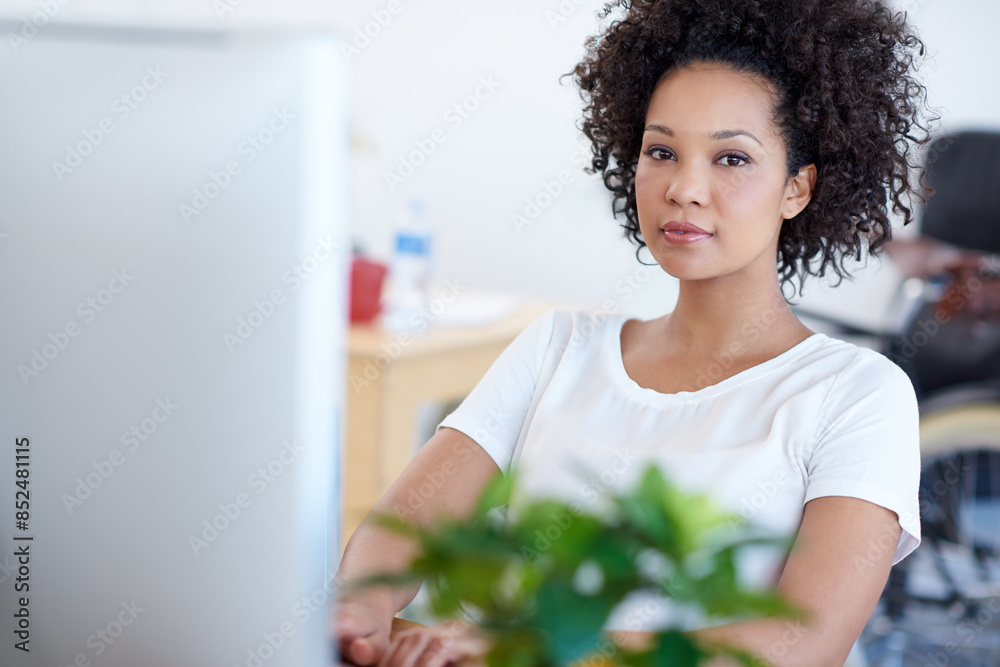 Portrait, serious or African woman on computer for digital project development or problem solving. Web designer, solution or female person typing on technology in creative agency or startup business Portrait, serious or African woman on computer for digital project development or problem solving. Web designer, solution or female person typing on technology in creative agency or startup business