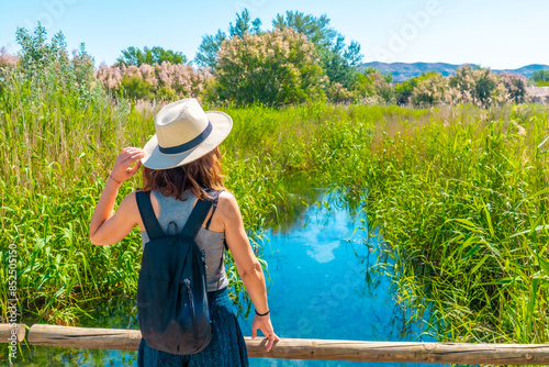 A tourist in the wetland of the Ojos del Pontil natural park in Rueda de Jalon. Valdejalon. Zaragoza. Aragon photo