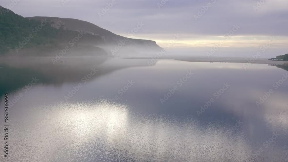Lake with mist by the ocean aerial Lake with mist by the ocean aerial