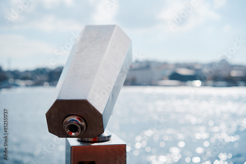 Coin Operated viewer next to the waterside promenade looking out to the bay and city. photo