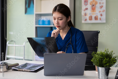 Fotografie Close up of a stethoscope and digital tablet with virtual electronic medical record of patient on interface