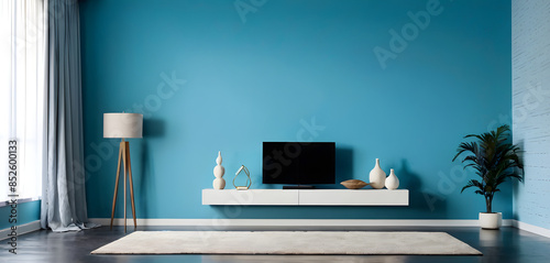 Interior designer showcasing a trendy living room with blue wall and minimalist furniture