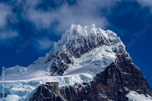 A majestic view of the snow, ice, and glacier capped peak of the Cerro Paine Grande photo