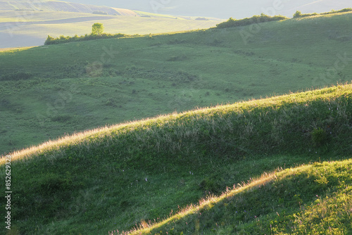 sunset over the green plains of Tranylvania photo