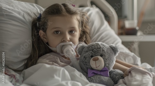 The child in hospital bed photo