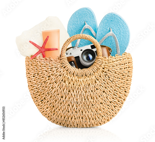 beach bag with summer accessories on white isolated background