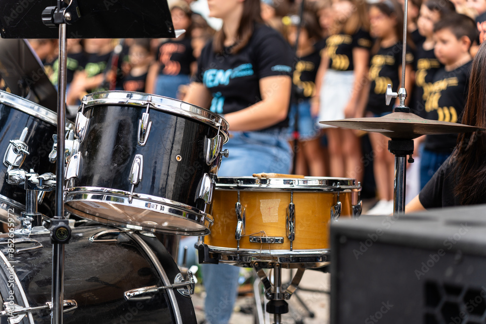 Fototapeta premium Female musician percussionist playing drums