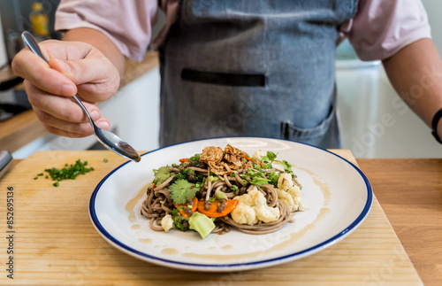 Wallpaper Mural Chef at the kitchen preparing japanese buckwheat pasta with lentils Torontodigital.ca