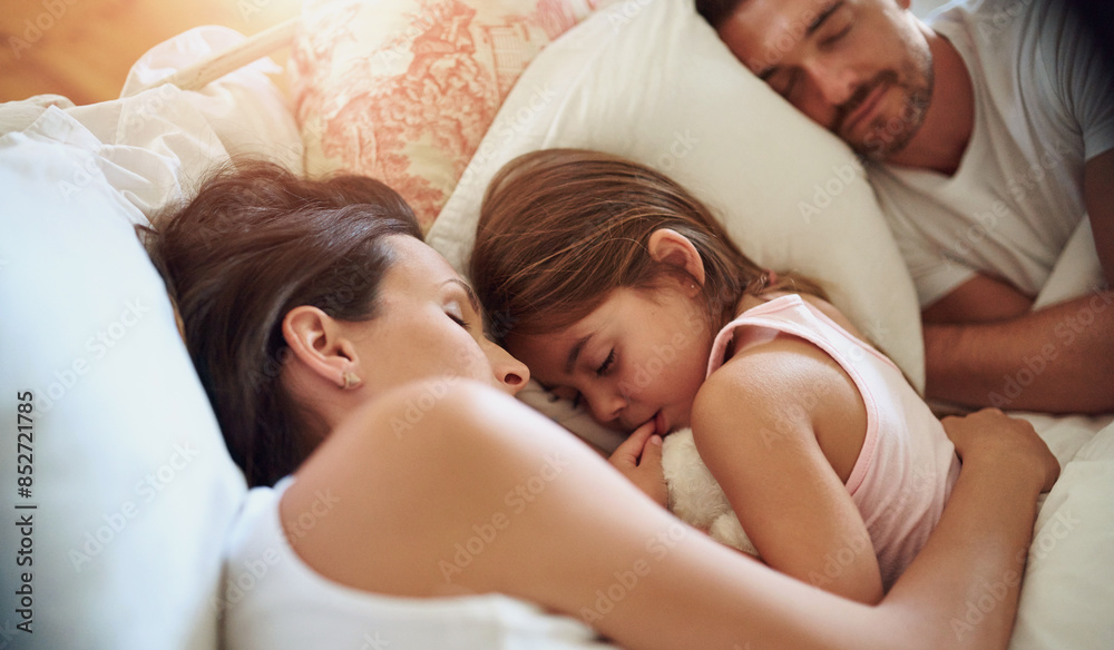 Family, parents and kid sleeping in bedroom for peace, calm and relax together for love in home. Mother, father and girl child in bed to rest for health, dream and cuddle for comfort or tired Family, parents and kid sleeping in bedroom for peace, calm and relax together for love in home. Mother, father and girl child in bed to rest for health, dream and cuddle for comfort or tired