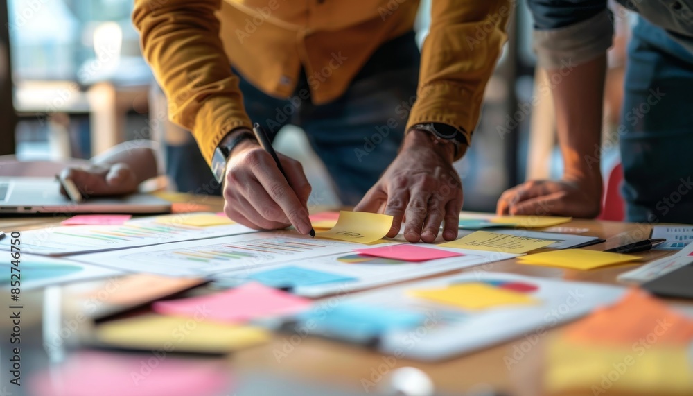 Businessman working on project with sticky notes Businessman working on project with sticky notes