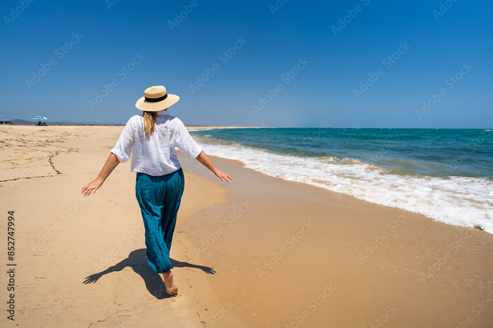 Beautiful woman walking on sunny beach Portugal, Algarve, praia Armona
Beautiful woman walking on sunny beach Portugal, Algarve, praia Armona