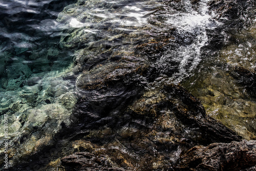 Sea stones on the beach in the sand. Sea landscape.  photo