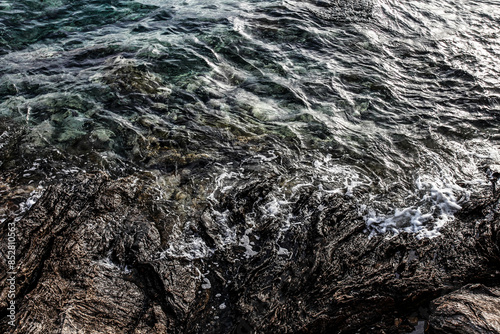 Sea stones on the beach in the sand. Sea landscape. 