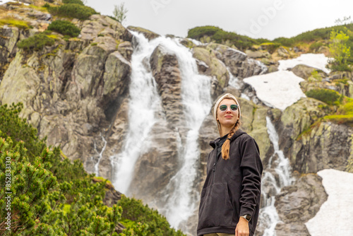 beautiful girl hiking in the Polish mountains during the summer day