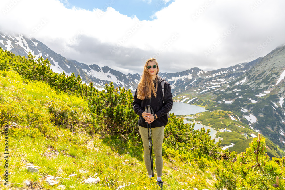 beautiful girl hiking in the Polish mountains during the summer day
