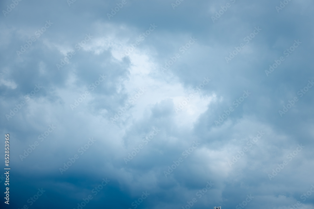 The sky is filled with clouds and the color is blue The sky is filled with clouds and the color is blue