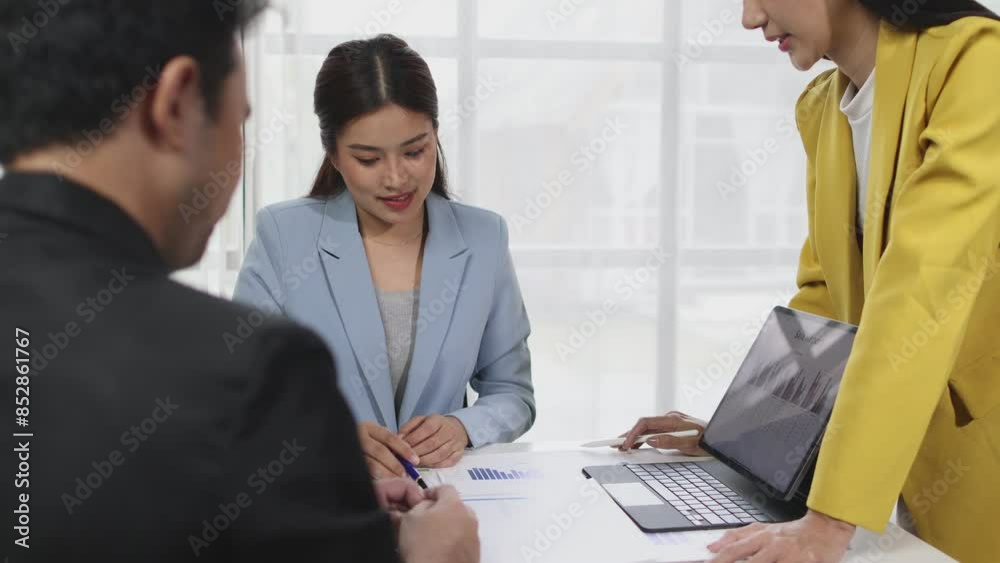Business meeting, Asian businesswoman is presenting ideas and talking with colleagues in a conference room at the office. Business meeting, Asian businesswoman is presenting ideas and talking with colleagues in a conference room at the office.
