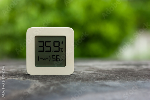 Best personal weather station device with weather conditions inside and outside. Home digital weather forecast concept with temperature and humidity.