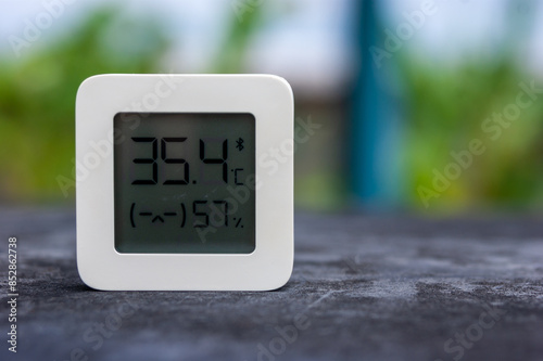 Best personal weather station device with weather conditions inside and outside. Home digital weather forecast concept with temperature and humidity.
