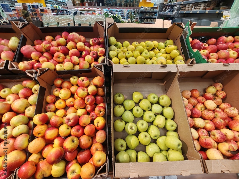 A display of apples in a grocery store A display of apples in a grocery store