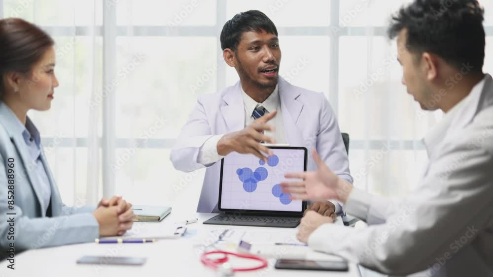 Doctors are meeting to discuss successful medical research, medical cooperation. Team of doctors is talking and discussing in a conference room at the hospital. Doctors are meeting to discuss successful medical research, medical cooperation. Team of doctors is talking and discussing in a conference room at the hospital.