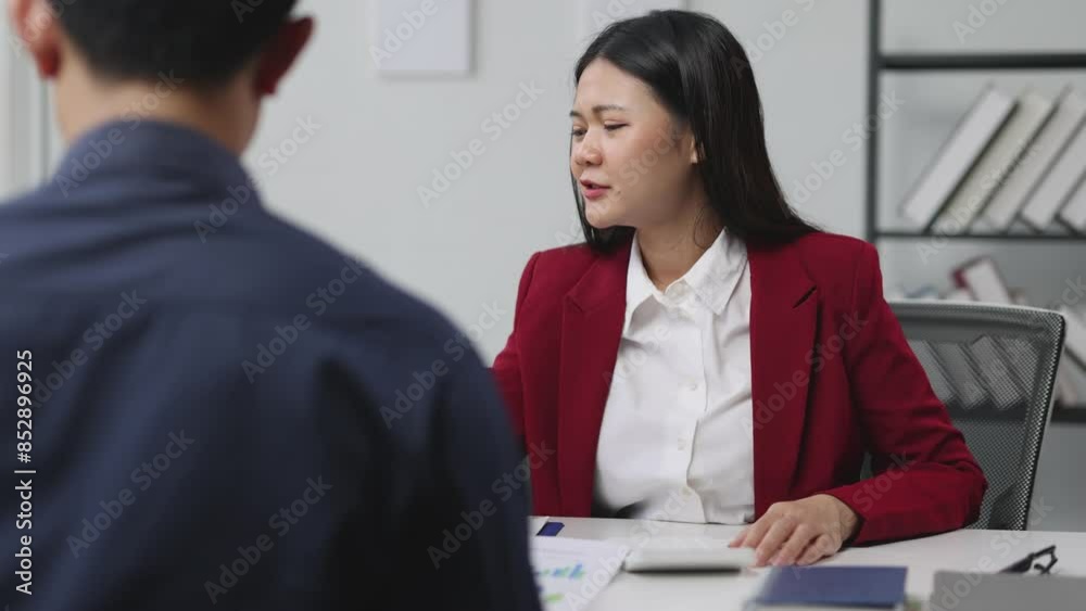 Businesswoman talking during a meeting with colleagues to discuss planning new business projects. Businesswoman talking during a meeting with colleagues to discuss planning new business projects.