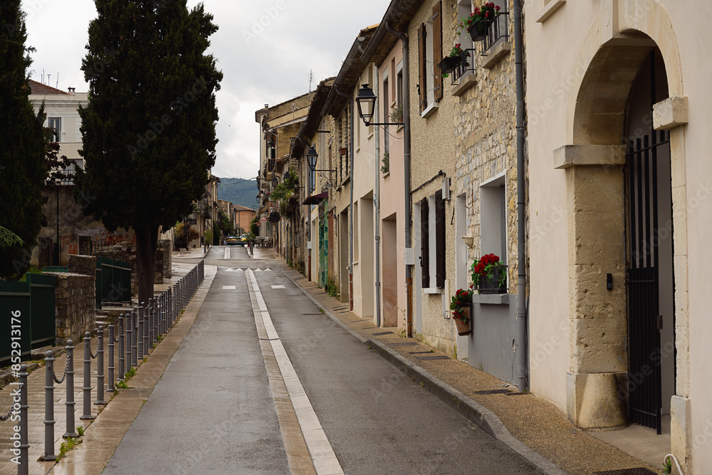 A SIDE STREET SHOWING EUROPEAN ARCHITECTURE AND DESIGN IN THE CITY OF VAISON-LA-ROMAINE IN PROVENCE FRANCE A SIDE STREET SHOWING EUROPEAN ARCHITECTURE AND DESIGN IN THE CITY OF VAISON-LA-ROMAINE IN PROVENCE FRANCE