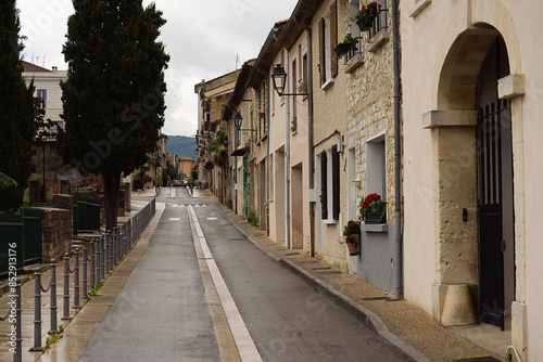 A SIDE STREET SHOWING EUROPEAN ARCHITECTURE AND DESIGN IN THE CITY OF VAISON-LA-ROMAINE IN PROVENCE FRANCE