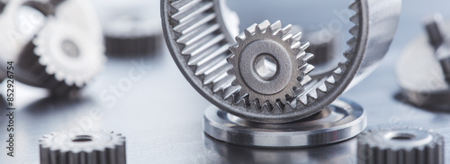 metal gears and bearings. Background with part of the mechanism.