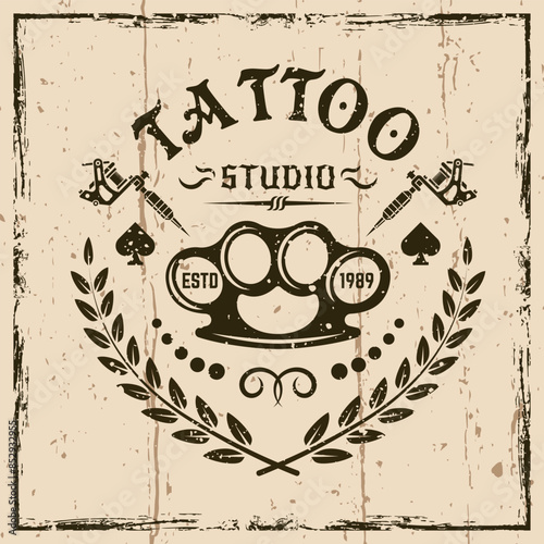 Tattoo studio vector emblem in vintage style on background with grunge textures