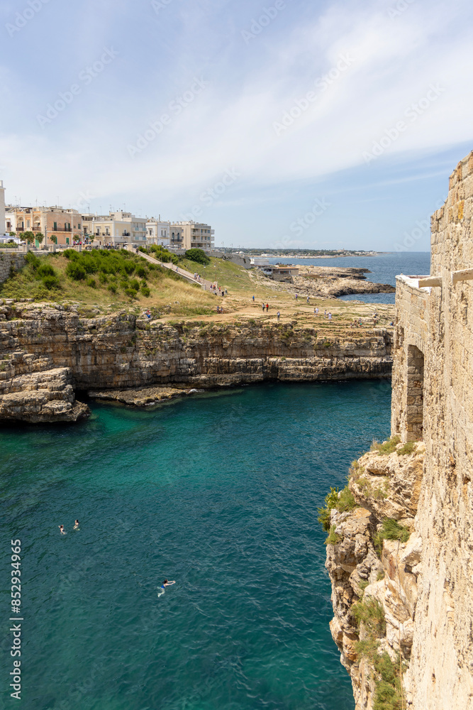 Lama Monachile beach, located between picturesque cliffs by Adriatic Sea, Polignano a Mare, Italy, Apulia