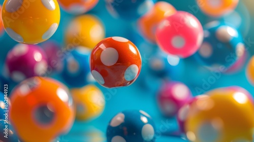 A bunch of colorful balls with polka dots are floating in the air photo