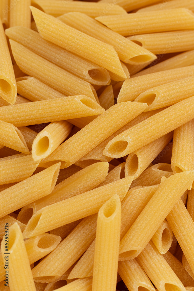 High-quality Italian pasta penne rigate. Extruded through traditional bronze dies. Top view. High-quality Italian pasta penne rigate. Extruded through traditional bronze dies. Top view.