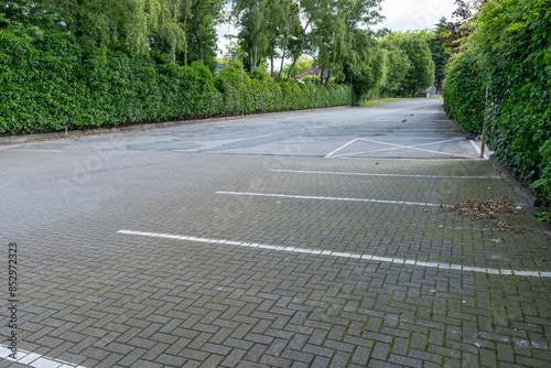 Tablou pe pânză desolate parking lot without cars and people