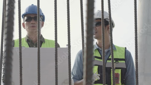 Inspector engineer  checking steel for structure on site construction.
