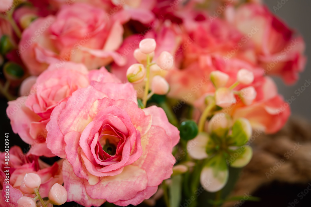 A bouquet of pink flowers with green leaves A bouquet of pink flowers with green leaves