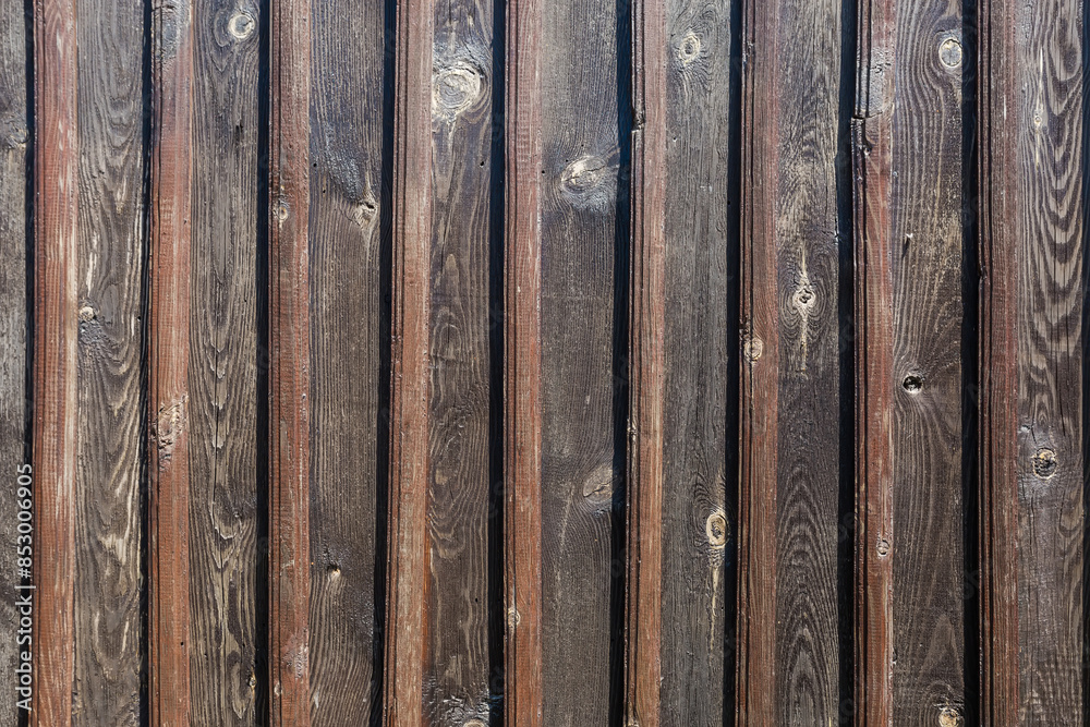 Fragment of wooden wall of old building of dark planks Fragment of wooden wall of old building of dark planks