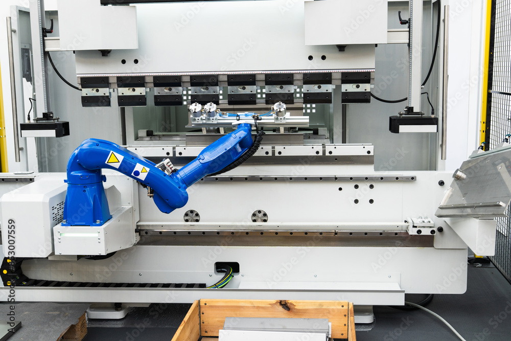 A robotic arm. Automatic robot in a smart factory A robotic arm. Automatic robot in a smart factory
