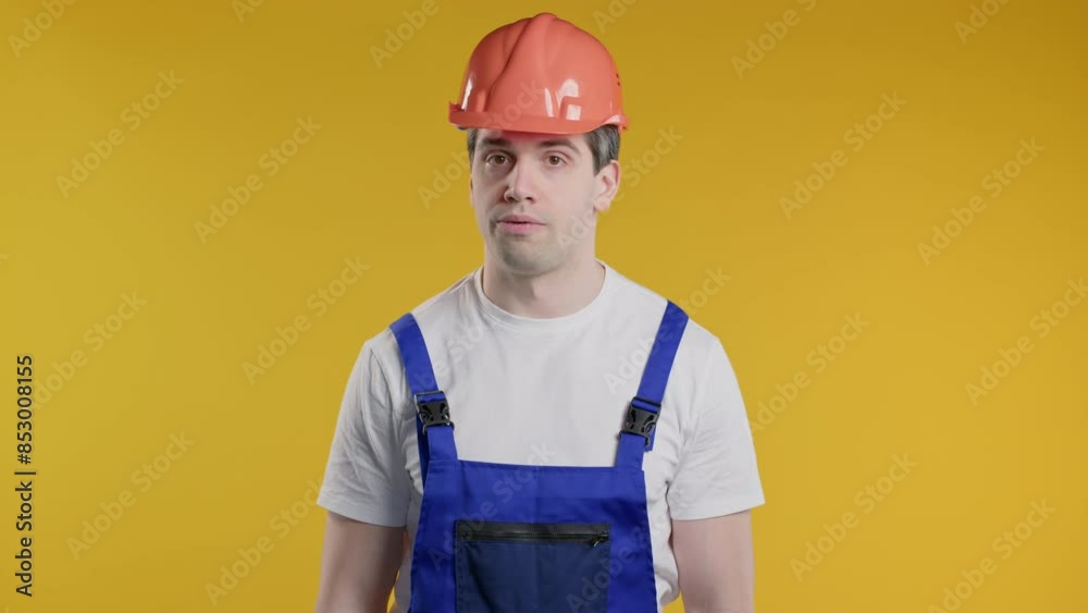 Bored Upset Handyman in Helmet Sighs, Rolling Eyes On Yellow. Irritated Dude Displeasure