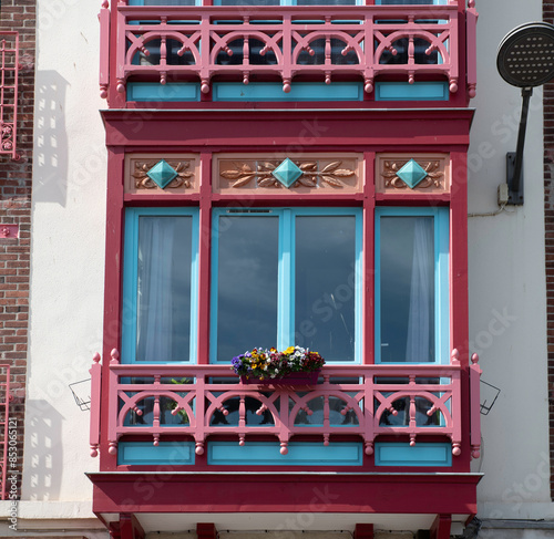 red balcony of Belle Epoque houses along the French coast
