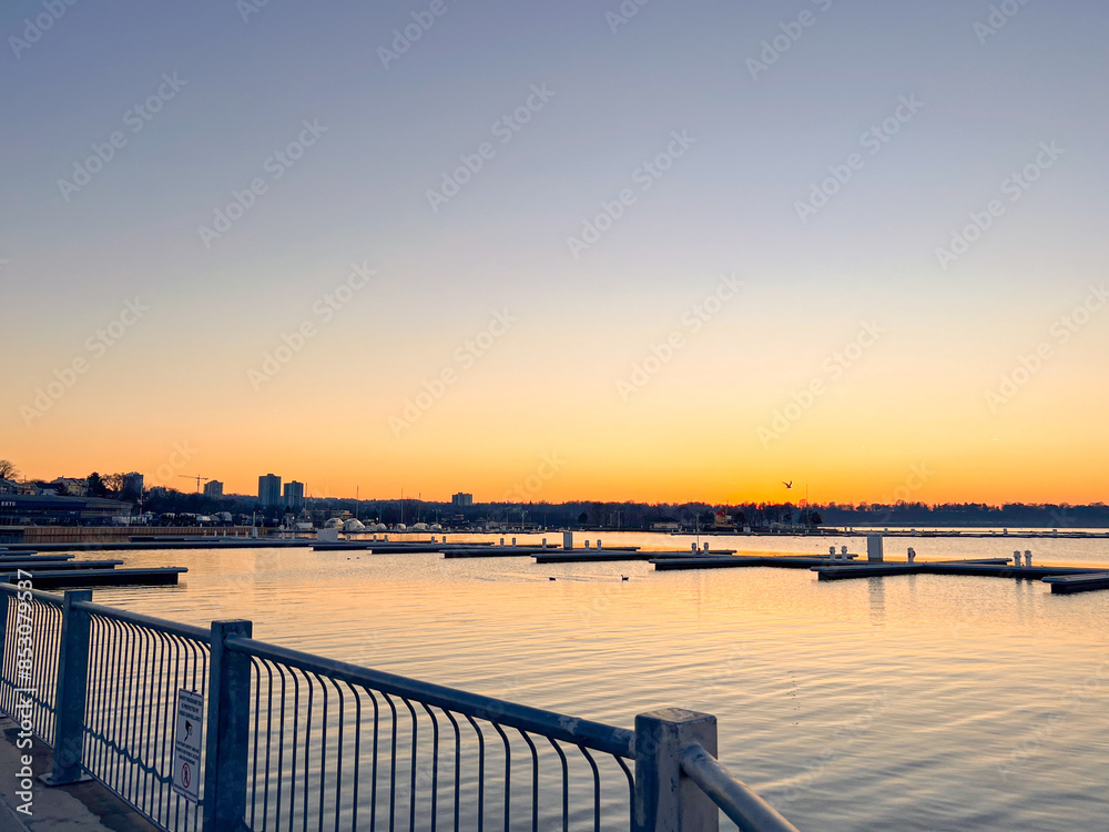Sunset on the waterfront, illuminating the sea Sunset on the waterfront, illuminating the sea
