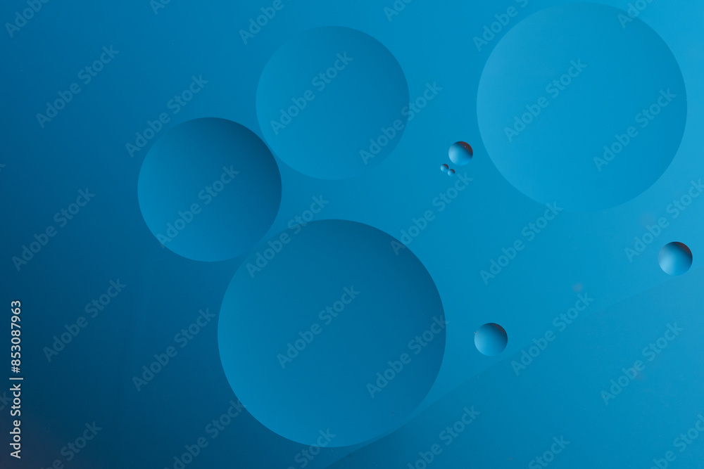 Abstract blue background with dynamic circles of different sizes. Abstract blue background with dynamic circles of different sizes.