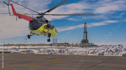 Collage. Yellow helicopter in the foreground. Drilling rig infrastructure on the Arctic oil and gas field in the background