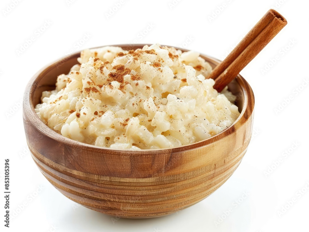 Rice Pudding A bowl of rice pudding with a cinnamon stick Rice Pudding A bowl of rice pudding with a cinnamon stick