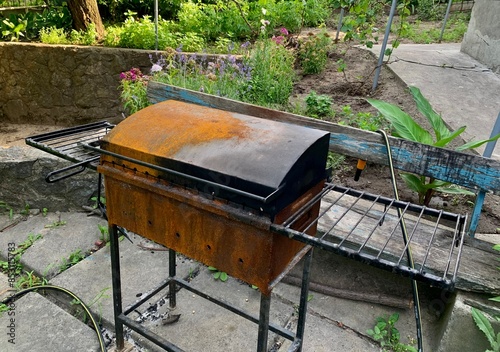 Rusty outdoor barbecue grill metal racks garden homemade patio