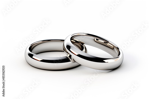 a two white gold wedding rings isolated on clear white background