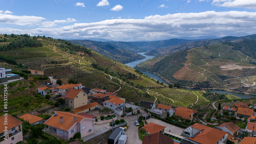 View of the terraced vineyards in the Douro Valley and river near the village of Pinhao, Portugal. Concept for travel in Portugal and most beautiful places in Portugal View of the terraced vineyards in the Douro Valley and river near the village of Pinhao, Portugal. Concept for travel in Portugal and most beautiful places in Portugal