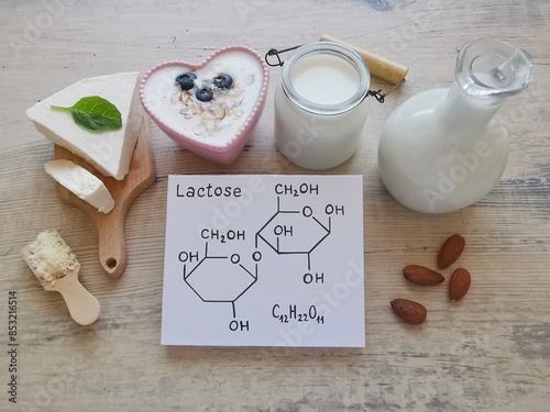 Valokuva Foods high in lactose with structural chemical formula of lactose