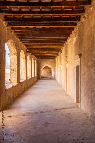 Europe, Greece, Crete, Rethymno. Venetian Baroque, 16th C. Eastern Orthodox Monastery.  The Holy Monastery of Arkadi. Arched stone passageway.