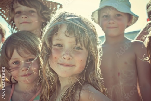 Portrait of a group of children on the beach in the sun